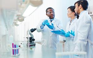 Scientists talking in a lab.